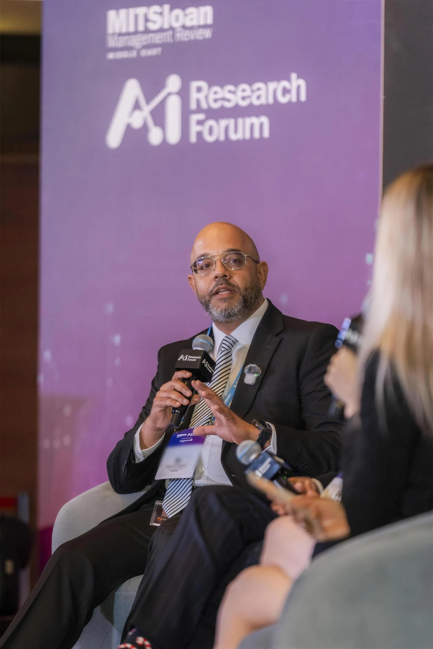 Noel D'Costa speaking at the MIT Sloan Management Review Middle East AI Research Forum